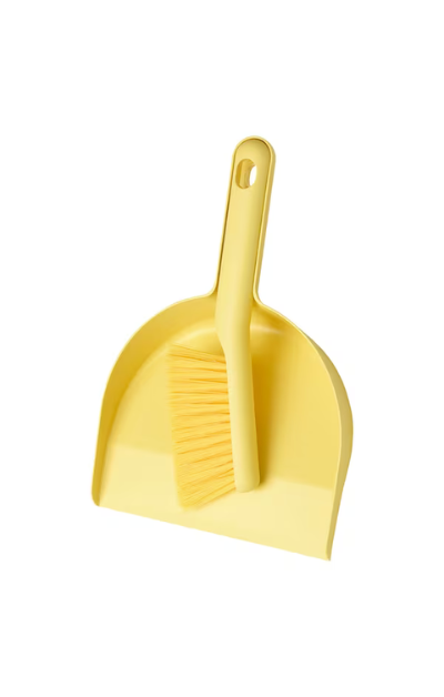 Plastic dustpan with brush for efficient cleaning"